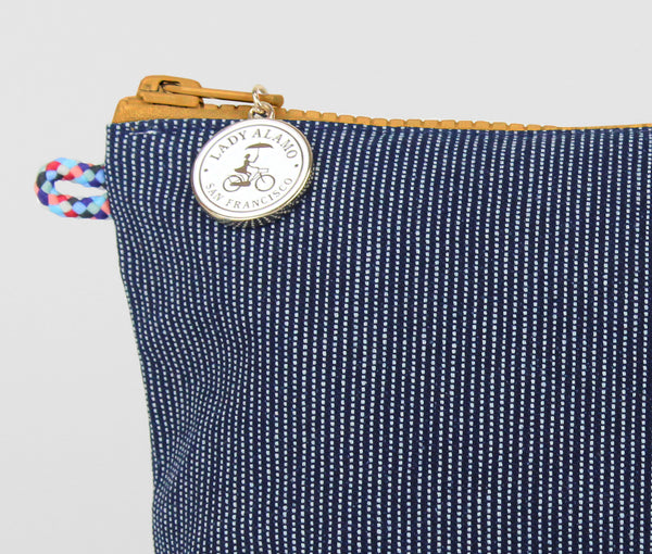 Little Zip; cosmetic pouch; cosmetic; cosmetic bag; water repllent; denim; zipper pouch; wristlet; made in usa; blue; stitch; Little; Pouch;