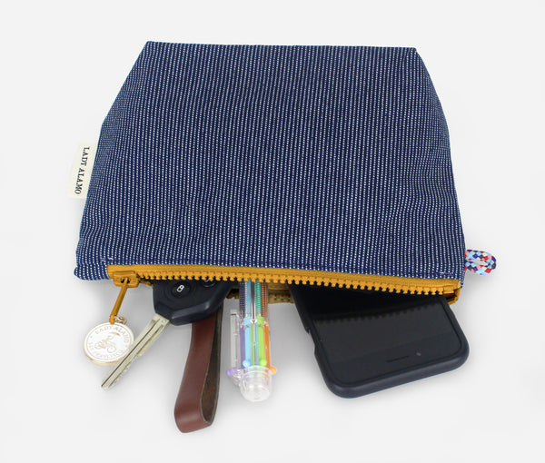 Little Zip; cosmetic pouch; cosmetic; cosmetic bag; water repllent; denim; zipper pouch; wristlet; made in usa; blue; stitch; Little; Pouch;