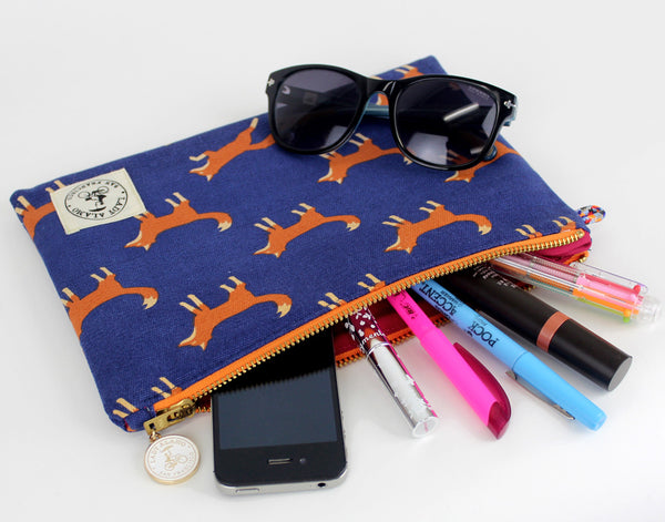 Miss Zip; cosmetic pouch; cosmetic; cosmetic bag; water repllent; fox; fox print; zipper pouch; wristlet; made in usa; navy; clutch; clutch purse; Pouch;